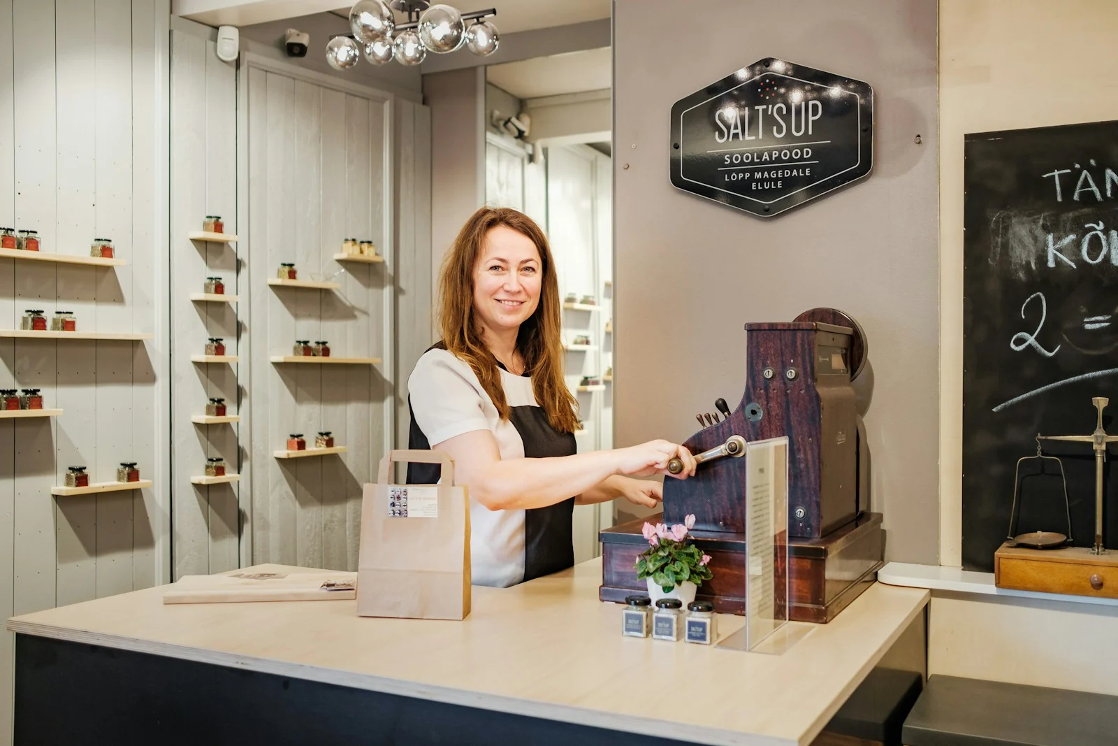 Owner at the counter of an independent homeware shop